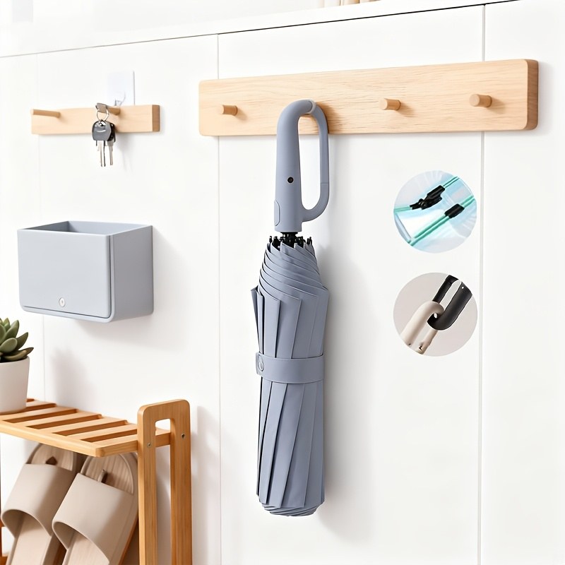 Umbrago hands-free umbrella hanging by entryway with carabiner clip